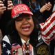 Mimi Israelah, center, cheers for Donald Trump inside the Alaska Airlines Center in Anchorage, Alaska, during a rally Saturday July 9, 2022. An investigation has been launched after a person believed to be an Anchorage, Alaska, police officer was shown in a photo with Israelah flashing a novelty “White Privilege card.” The social media post caused concerns about racial equality in Alaska’s largest city.